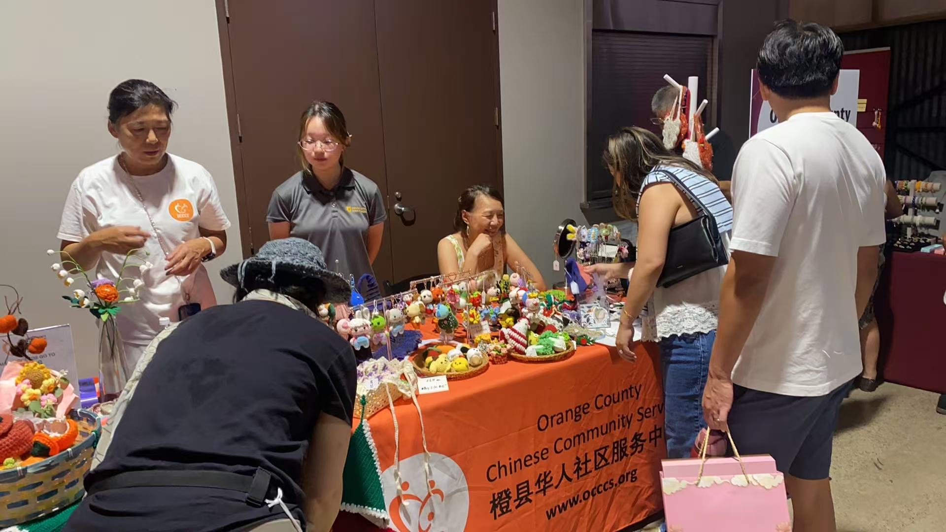 OCCCS charity sale booth with handmade crafts