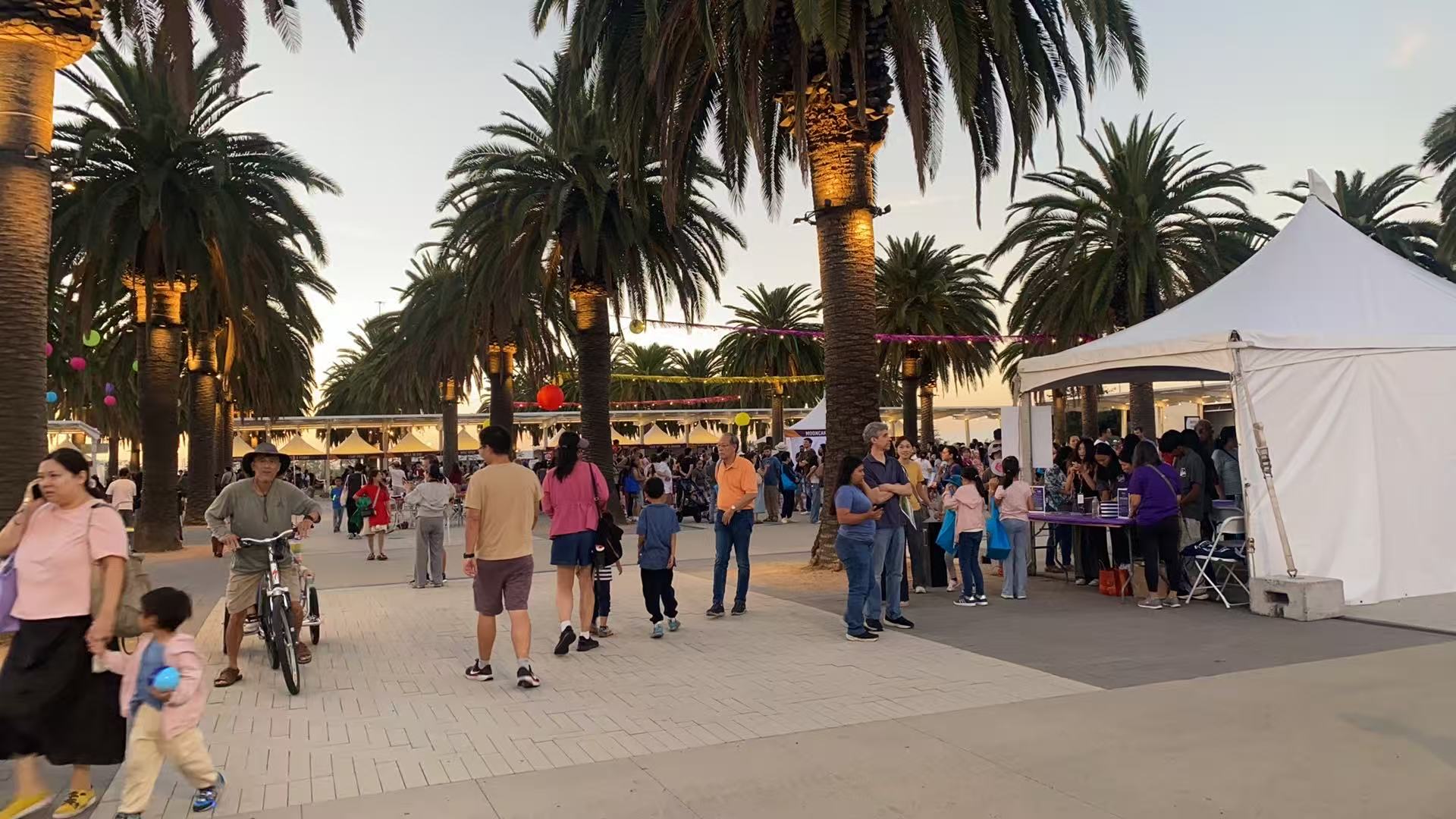 Festival plaza with lanterns and attendees