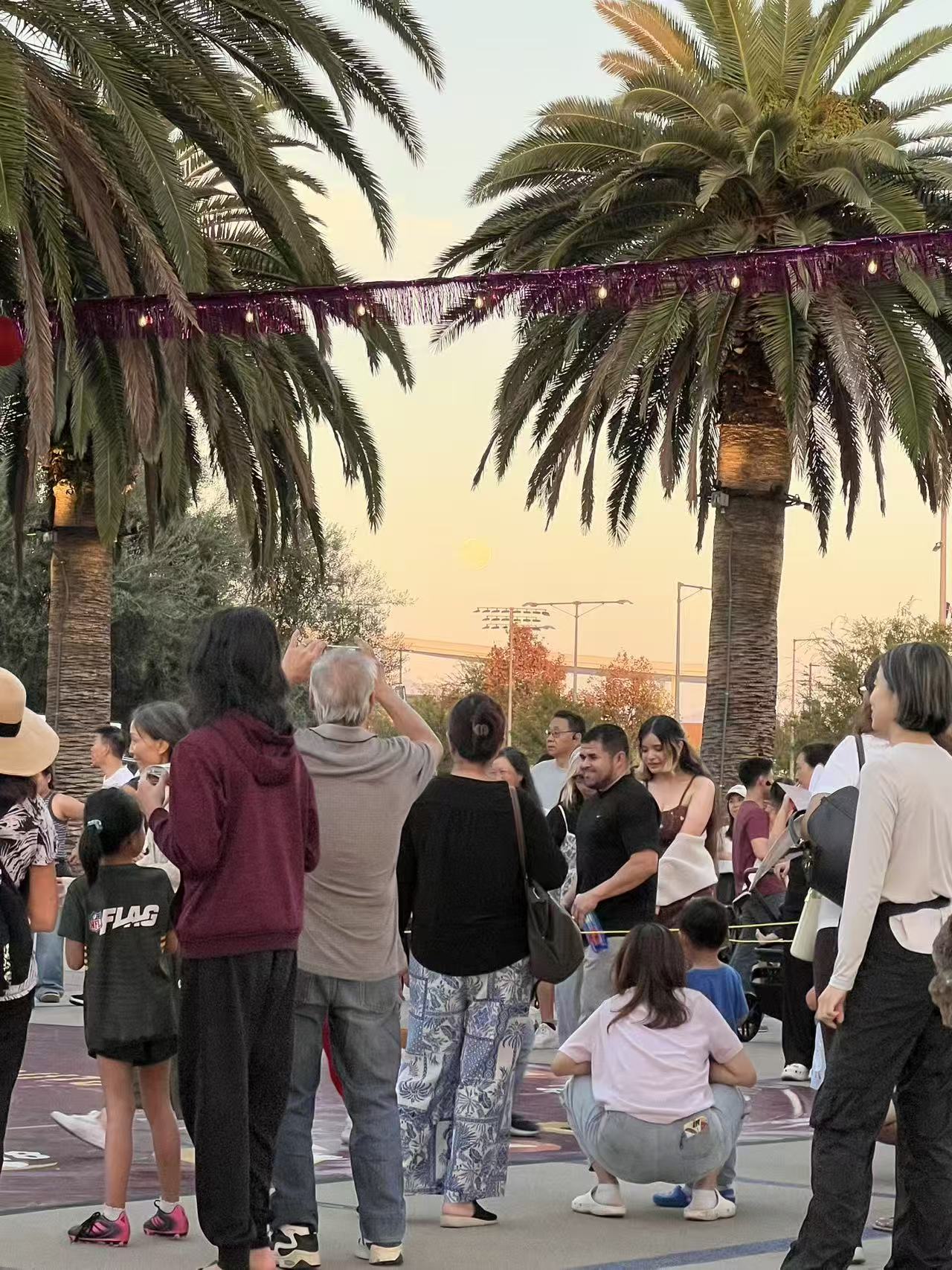 Attendees enjoying Mid-Autumn moonlit atmosphere